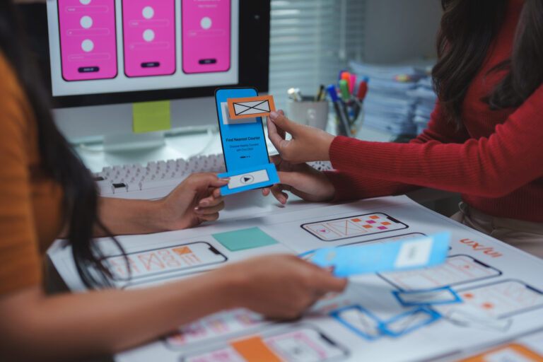 Ux designers working on user interface and user experience of mobile application