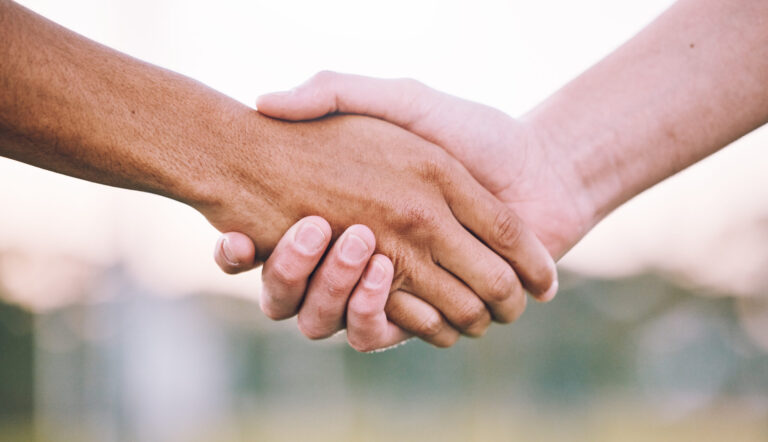 close-up-of-two-hands-shaking-each-other-2026-03-25-04-57-43-utc